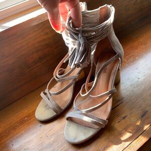 Strappy heeled sandals with straps around the ankle